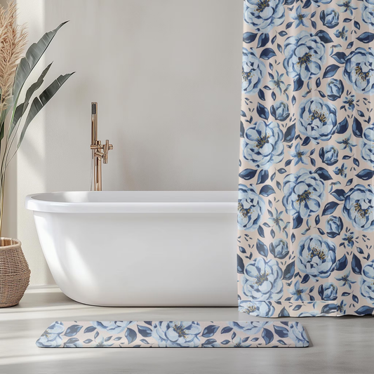 Bathroom setting with a white bathtub, floral-patterned shower curtain, and matching rug.