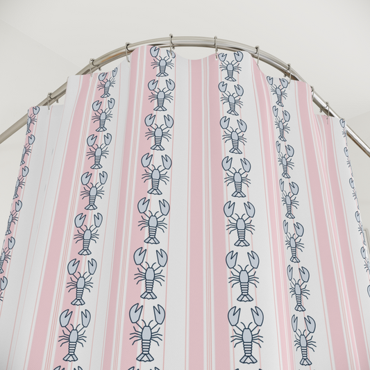 Striped fabric with lobster pattern on a circular rod against a white background