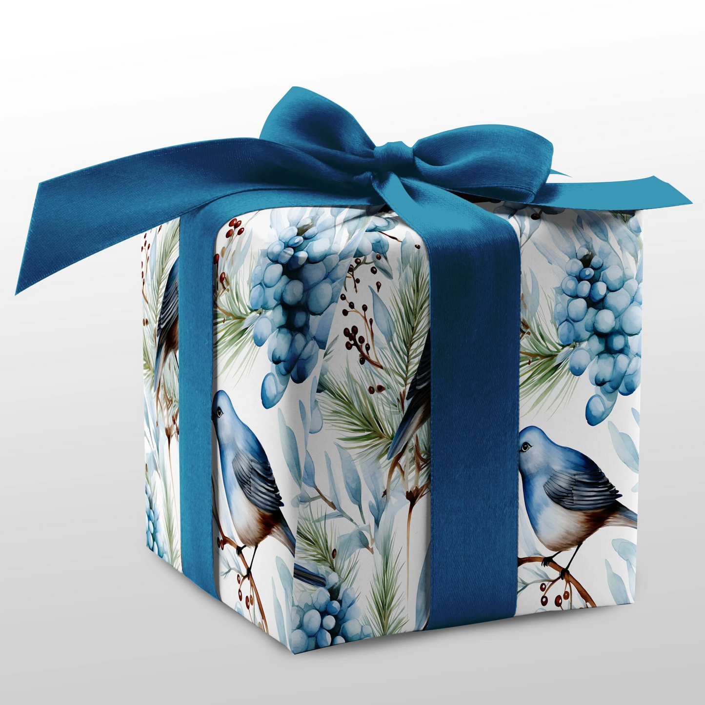 Gift box with blue ribbon and bird and berry pattern on a white background