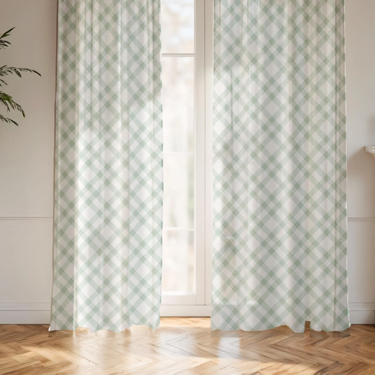 Patterned curtains in a room with wooden flooring and a plant.