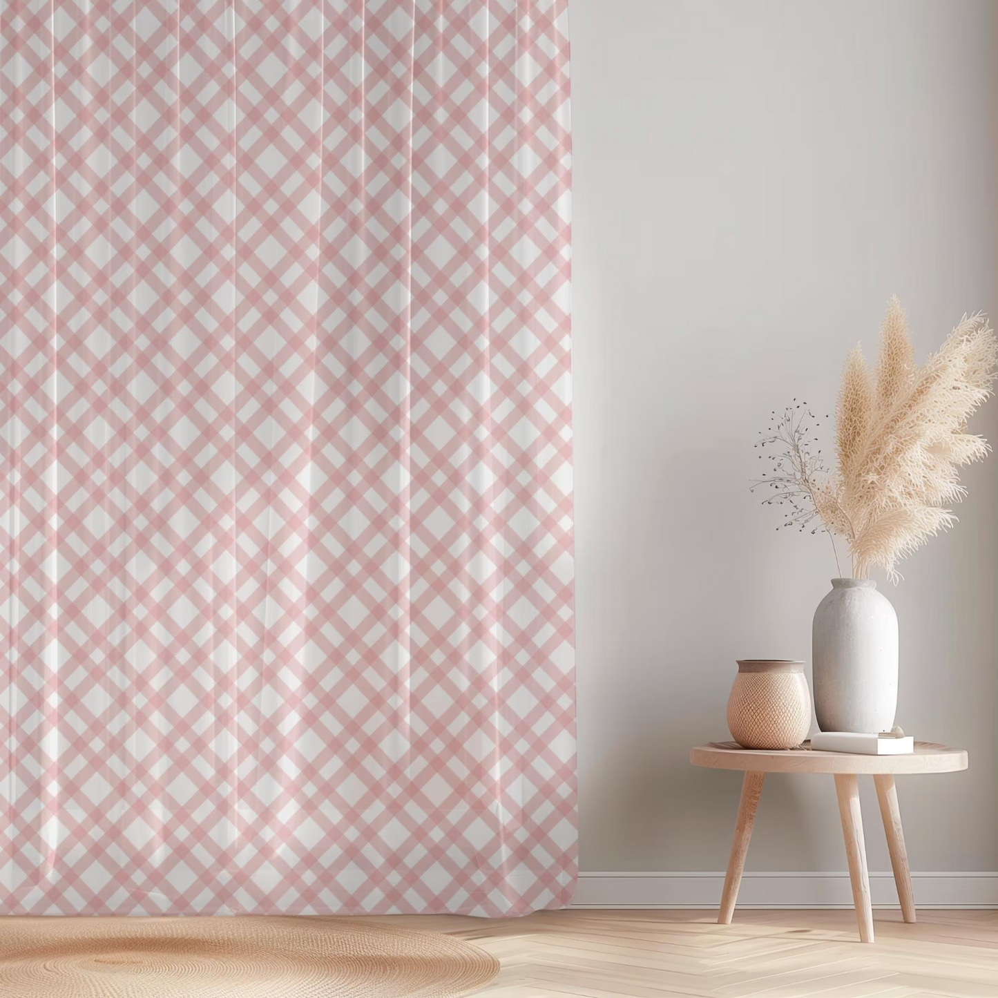 Pink and white patterned curtain with a small table and decorative items in a room.