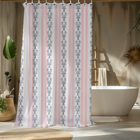 Shower curtain with pink and white pattern in a bathroom setting