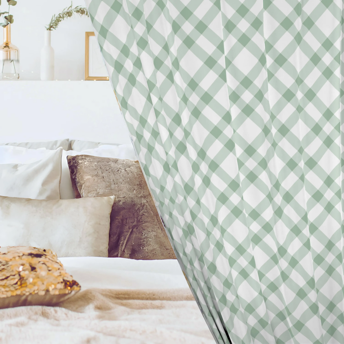 Green and white checkered curtain partially covering a bed with pillows and a wooden side table.