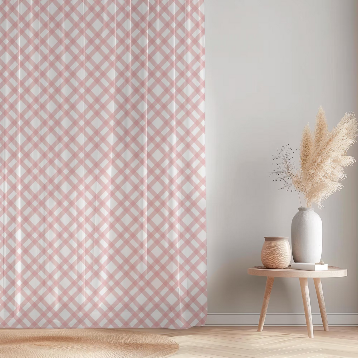 Pink and white patterned curtain with a small table and decorative items in a room.